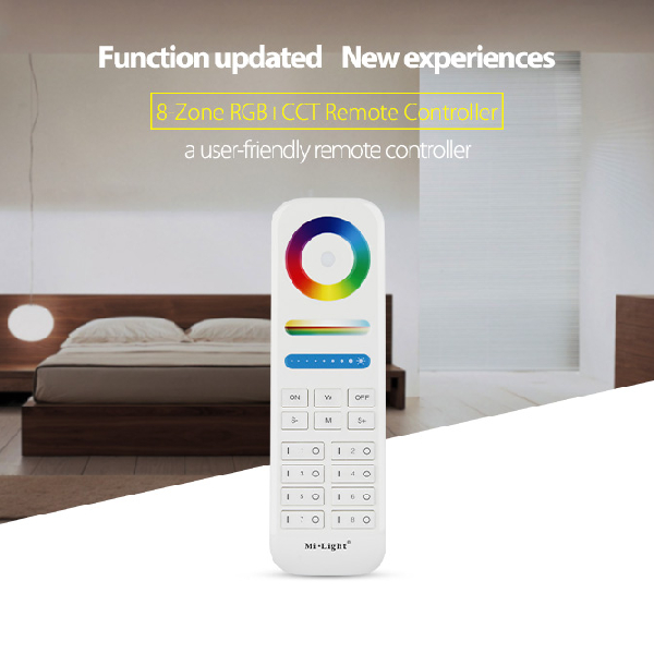 Beli osmozonski daljinski FUT089 ispred spavaće sobe sa drvenim krevetom, natpis 8-Zone RGB+CCT Remote Controller