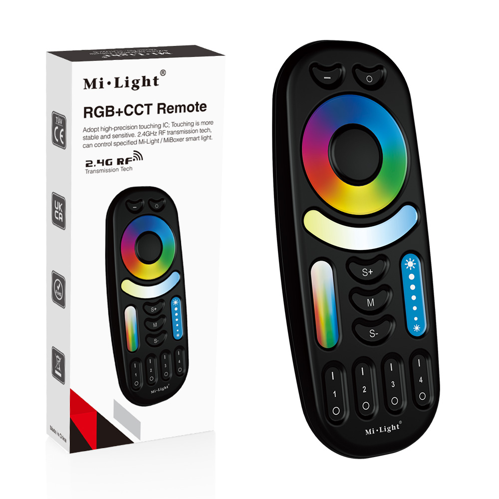 Daljinski FUT092-B u crnom kućištu pored kutije sa natpisom RGB+CCT Remote